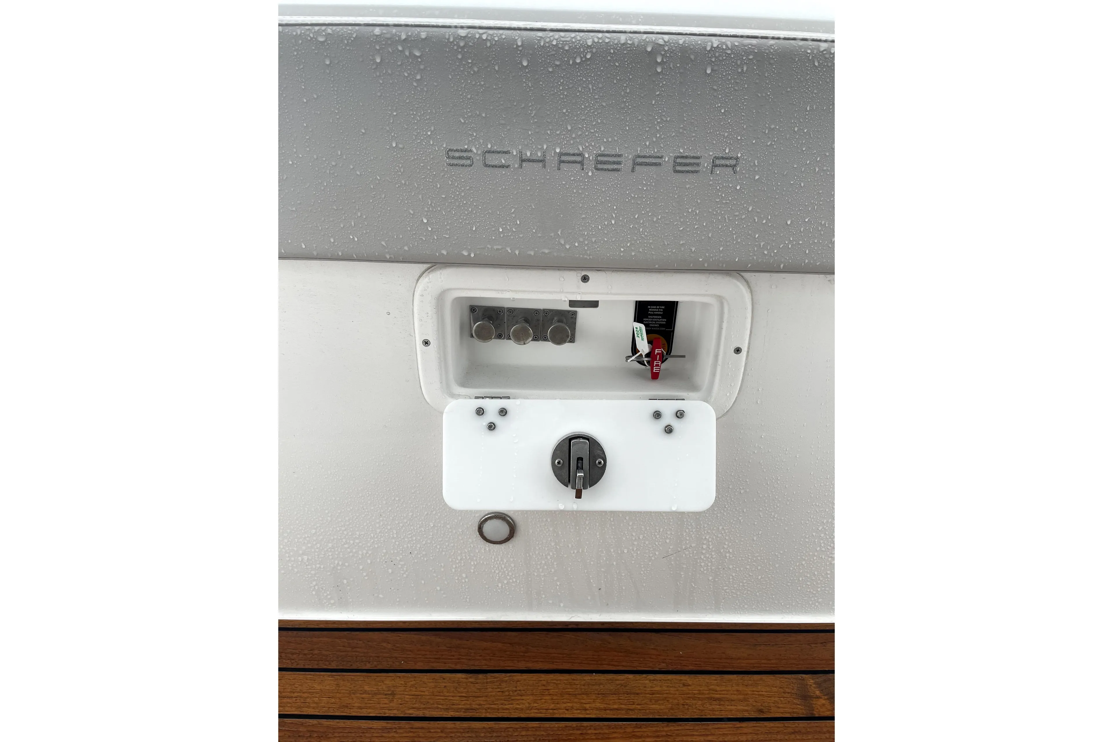 2024 Schaefer V33 boat control panel with switches and dials, featuring sleek design.