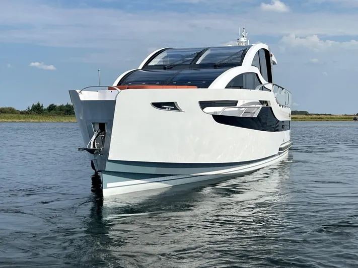  Yacht Photos Pics Vripack Utopia 58 yacht, 2013 model, cruising on calm waters under a clear sky.