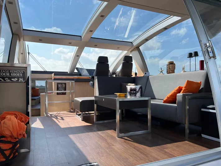  Yacht Photos Pics Luxurious interior of 2013 Vripack Utopia 58 yacht with panoramic windows and modern seating.