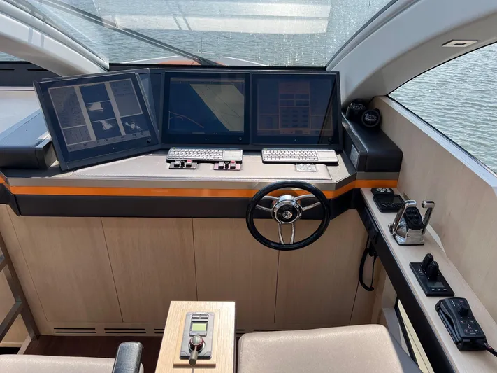  Yacht Photos Pics Helm of 2013 Vripack Utopia 58 yacht with modern navigation screens and controls.