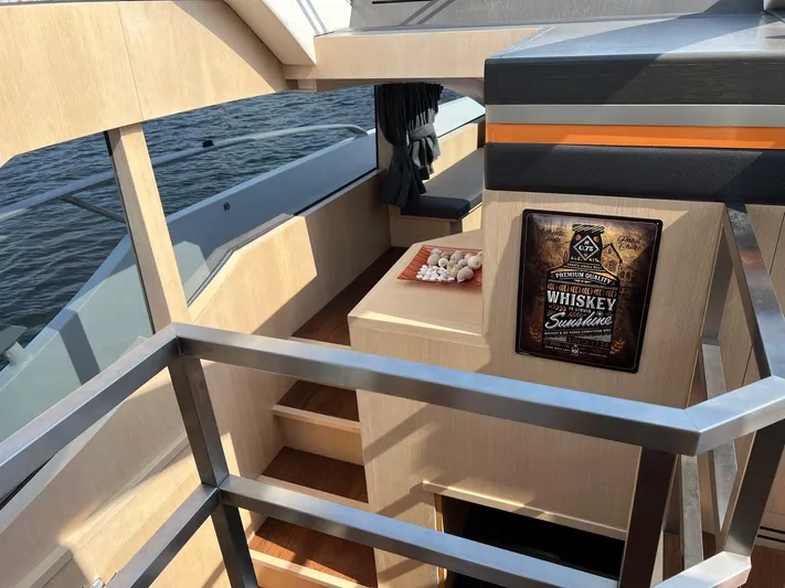  Yacht Photos Pics Interior of 2013 Vripack Utopia 58 yacht with whiskey-themed decor.