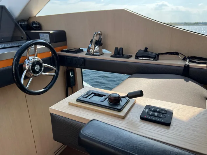  Yacht Photos Pics Helm of 2013 Vripack Utopia 58 yacht with steering wheel and controls.