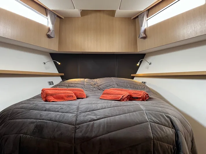  Yacht Photos Pics Luxurious cabin interior of 2013 Vripack Utopia 58 yacht with cozy bedding and ambient lighting.