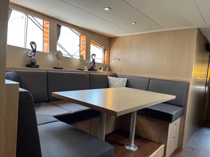  Yacht Photos Pics Modern interior of 2013 Vripack Utopia 58 yacht with cozy seating and elegant decor.