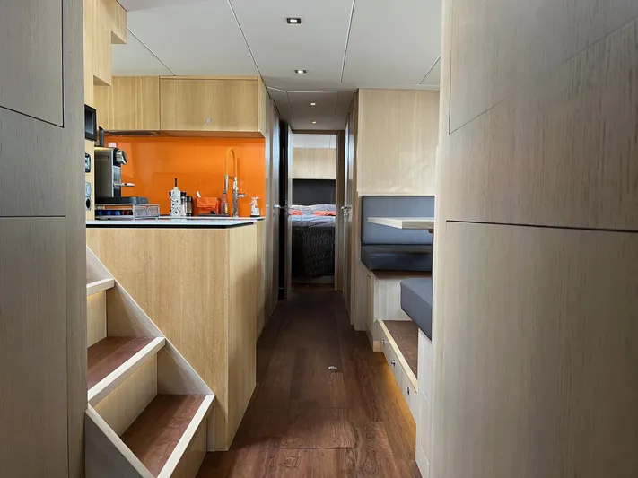  Yacht Photos Pics Interior of 2013 Vripack Utopia 58 yacht with modern kitchen and seating area.