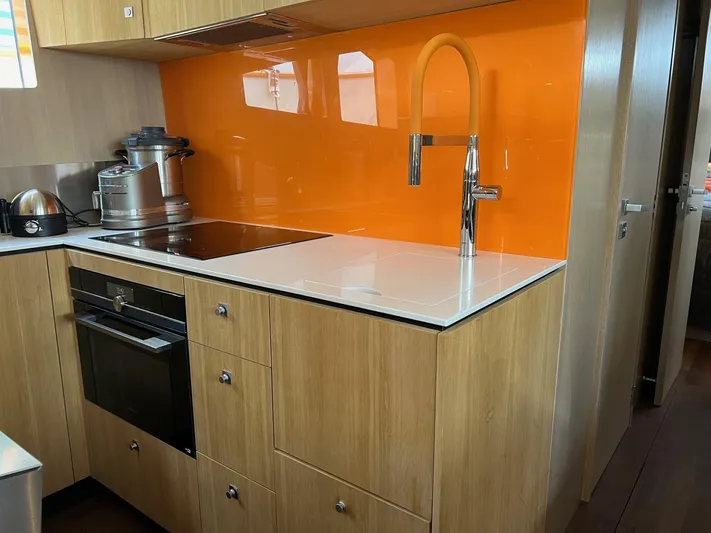  Yacht Photos Pics Modern kitchen in 2013 Vripack Utopia 58 yacht with orange backsplash and sleek appliances.