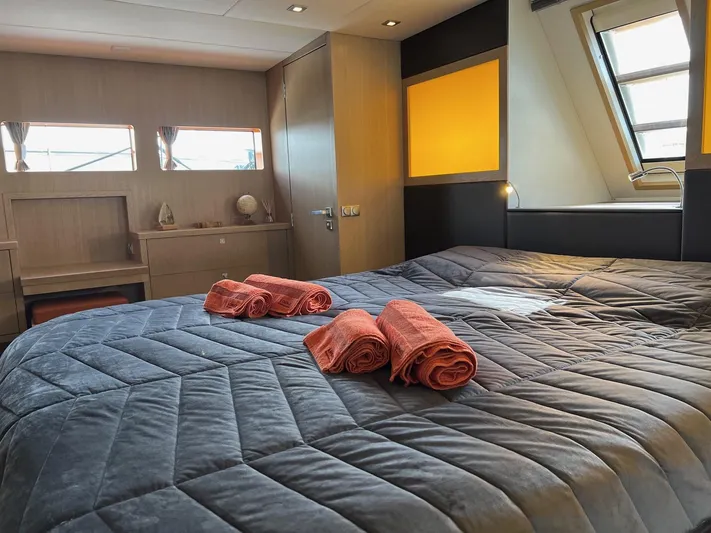  Yacht Photos Pics Luxurious bedroom interior of 2013 Vripack Utopia 58 yacht with cozy bedding and decor.
