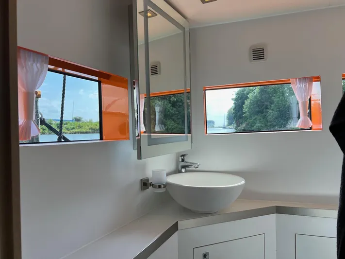  Yacht Photos Pics Modern bathroom interior on 2013 Vripack Utopia 58 yacht with scenic window views.