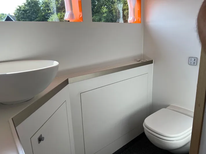  Yacht Photos Pics Modern bathroom interior on Vripack Utopia 58 yacht, featuring sleek sink and toilet, 2013 model.