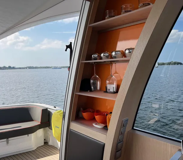  Yacht Photos Pics Interior of 2013 Vripack Utopia 58 yacht with shelves and scenic water view.