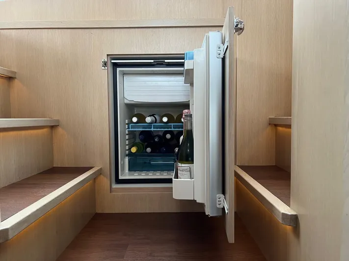  Yacht Photos Pics Compact fridge with wine bottles inside Vripack Utopia 58 yacht, 2013 model.