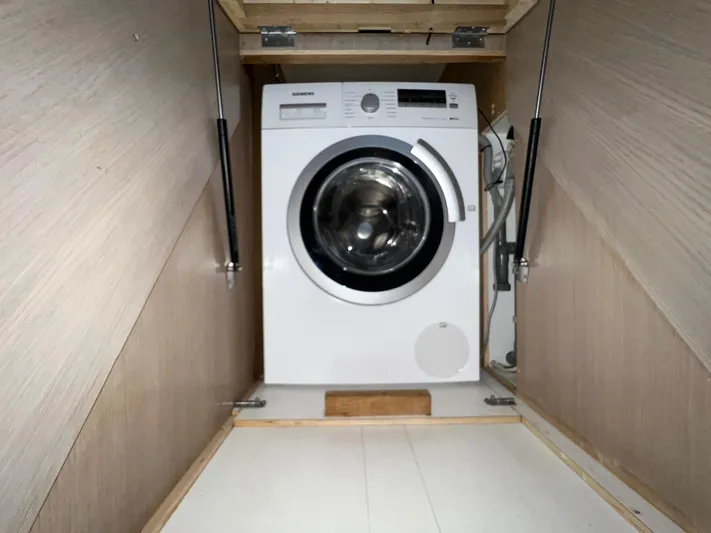  Yacht Photos Pics Washing machine in a compact wooden compartment on Vripack Utopia 58 yacht, 2013 model.