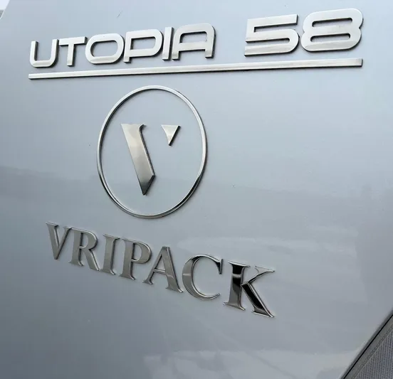  Yacht Photos Pics Vripack Utopia 58 yacht logo, 2013 model, featuring sleek metallic design.