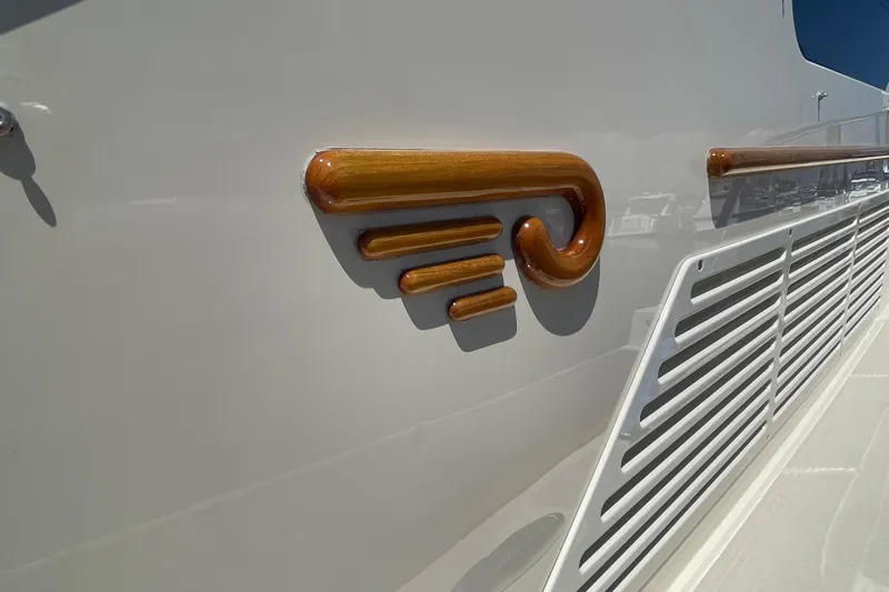 White Sauce Yacht Photos Pics 2017 Hinckley Talaria 43 Motoryacht, elegant wood detailing on sleek exterior design.