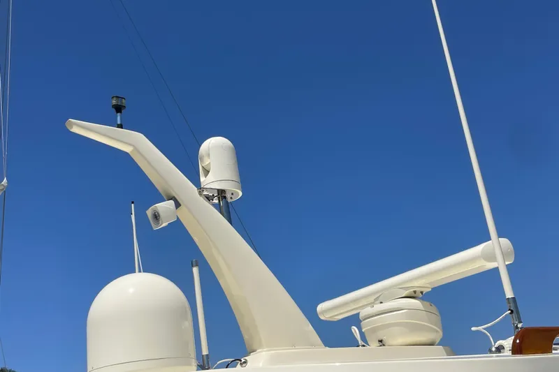 White Sauce Yacht Photos Pics Hinckley Talaria 43 Motoryacht 2017 radar and communication equipment against clear blue sky.