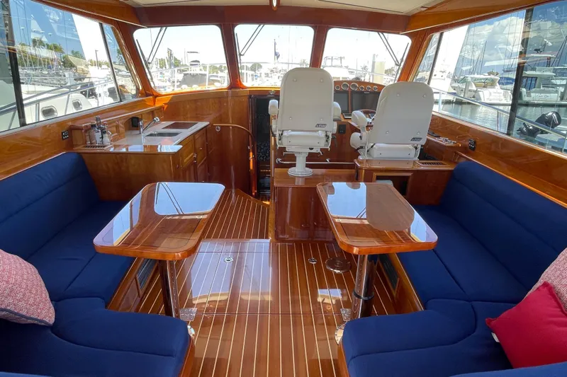 White Sauce Yacht Photos Pics Luxurious interior of 2017 Hinckley Talaria 43 Motoryacht with elegant wood finish and plush seating.