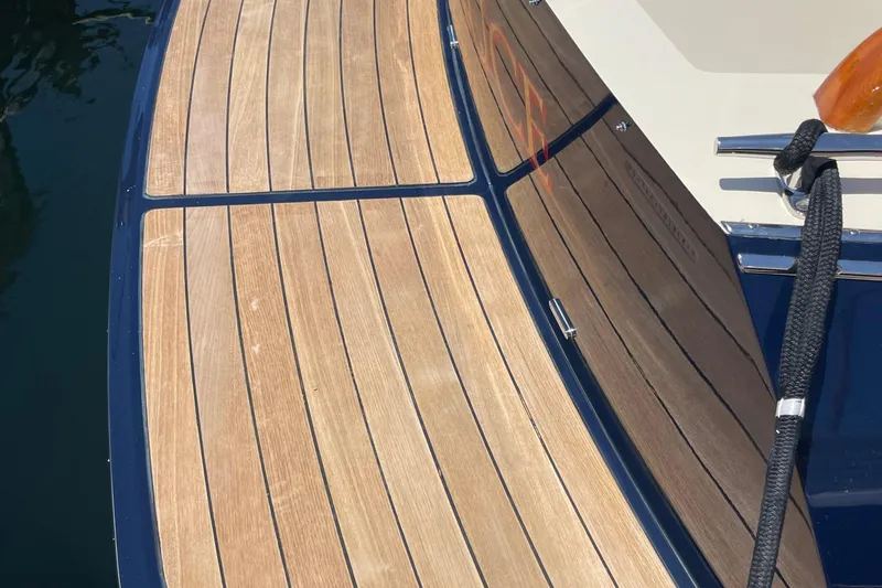 White Sauce Yacht Photos Pics Teak deck of 2017 Hinckley Talaria 43 Motoryacht with polished finish and mooring line.
