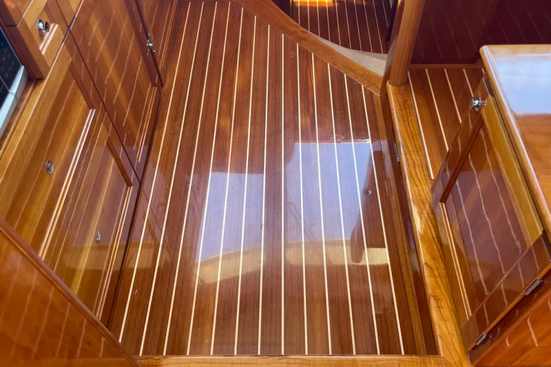 White Sauce Yacht Photos Pics Polished wooden interior of 2017 Hinckley Talaria 43 Motoryacht, showcasing elegant craftsmanship.