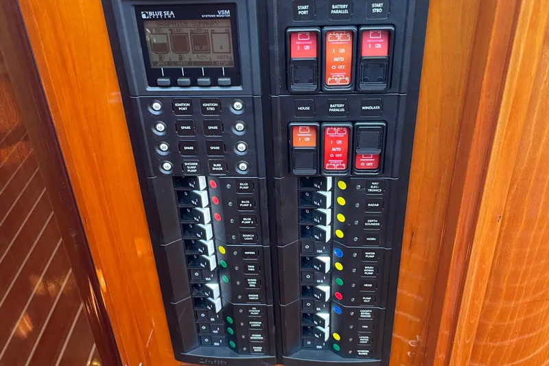 White Sauce Yacht Photos Pics Control panel of a 2017 Hinckley Talaria 43 Motoryacht with switches and indicators.