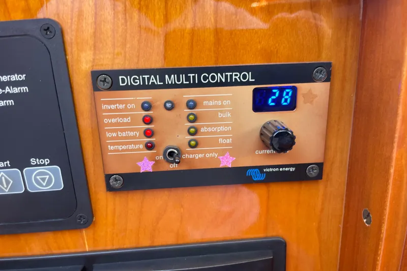 White Sauce Yacht Photos Pics Digital multi control panel on 2017 Hinckley Talaria 43 Motoryacht, featuring Victron Energy system.