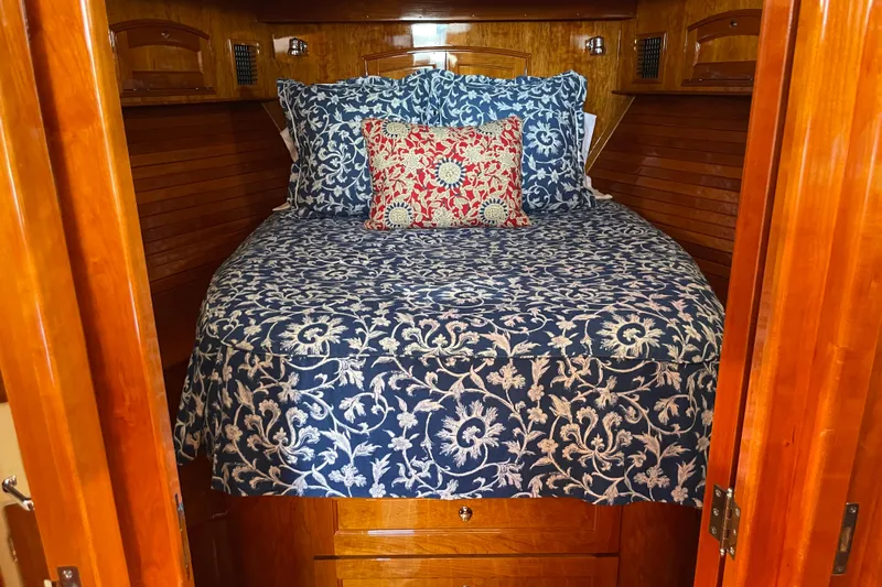 White Sauce Yacht Photos Pics Cozy cabin interior of 2017 Hinckley Talaria 43 Motoryacht with floral bedding.