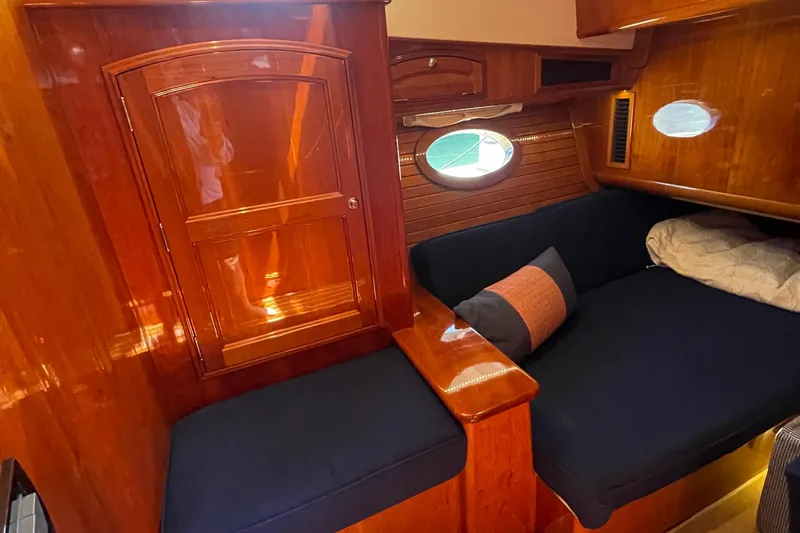 White Sauce Yacht Photos Pics Luxurious 2017 Hinckley Talaria 43 Motoryacht interior with polished wood and cozy seating.