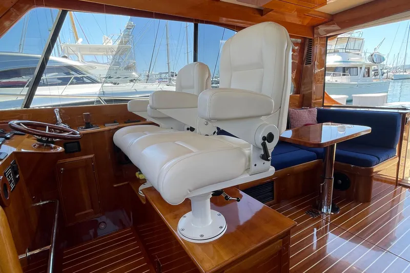 White Sauce Yacht Photos Pics Interior of 2017 Hinckley Talaria 43 Motoryacht with luxurious seating and wooden finishes.