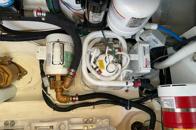 White Sauce Yacht Photos Pics Engine room of 2017 Hinckley Talaria 43 Motoryacht with mechanical components and wiring.