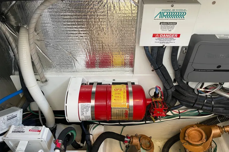 White Sauce Yacht Photos Pics Engine room of 2017 Hinckley Talaria 43 Motoryacht with fire suppression system and wiring.