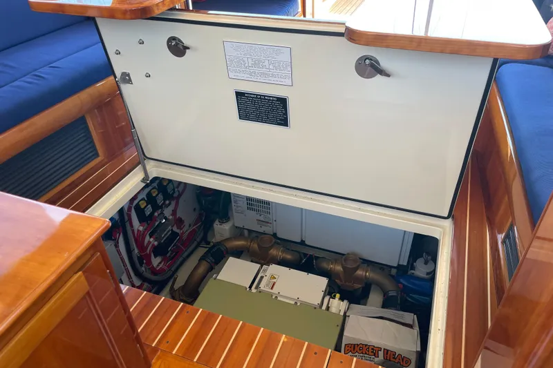 White Sauce Yacht Photos Pics Engine compartment of 2017 Hinckley Talaria 43 Motoryacht with open hatch and visible components.