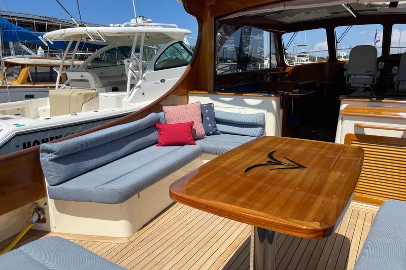 White Sauce Yacht Photos Pics Luxurious 2017 Hinckley Talaria 43 Motoryacht interior with elegant seating and wooden table.