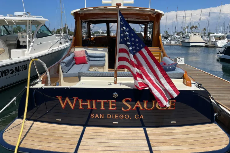 White Sauce Yacht Photos Pics Hinckley Talaria 43 Motoryacht 2017, named "White Sauce," docked in San Diego marina.