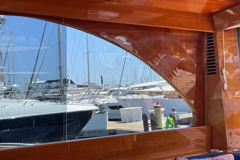 White Sauce Yacht Photos Pics Reflection of marina through window of 2017 Hinckley Talaria 43 Motoryacht.