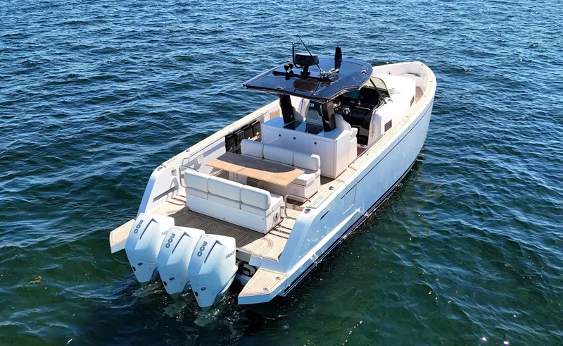  Yacht Photos Pics 2020 Pardo Yachts 38 cruising on open water, featuring dual outboard engines.