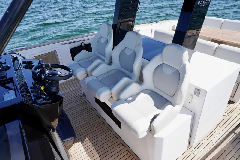  Yacht Photos Pics Luxury seating on 2020 Pardo Yachts 38, featuring sleek design and modern helm controls.