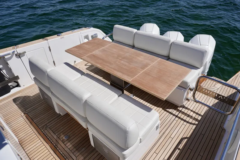 Yacht Photos Pics Luxury seating area on 2020 Pardo Yachts 38, featuring elegant wooden table.