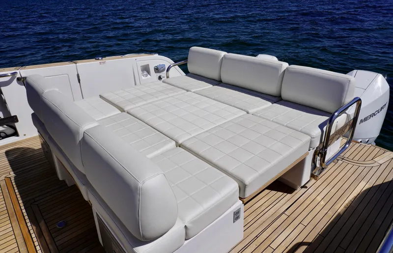  Yacht Photos Pics Luxurious seating area on 2020 Pardo Yachts 38, featuring white cushioned lounge, ocean backdrop.