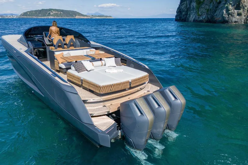  Yacht Photos Pics Luxurious 2024 Nerea Yacht NY40 cruising on clear blue waters, featuring elegant deck seating.