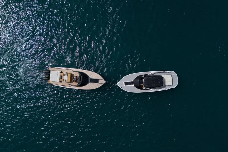  Yacht Photos Pics Aerial view of two luxury yachts, including a 2024 Nerea Yacht NY40, on open water.