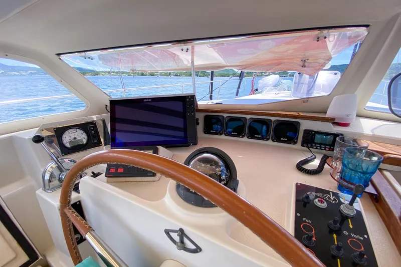  Yacht Photos Pics Cockpit of 1991 Amel Super Maramu sailboat with navigation instruments and steering wheel.