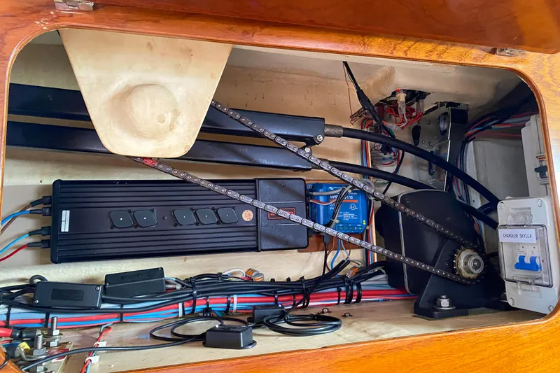  Yacht Photos Pics Electrical system inside a 1991 Amel Super Maramu sailboat, showcasing wiring and components.