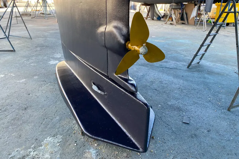  Yacht Photos Pics Keel and propeller of a 1991 Amel Super Maramu sailboat on dry dock.