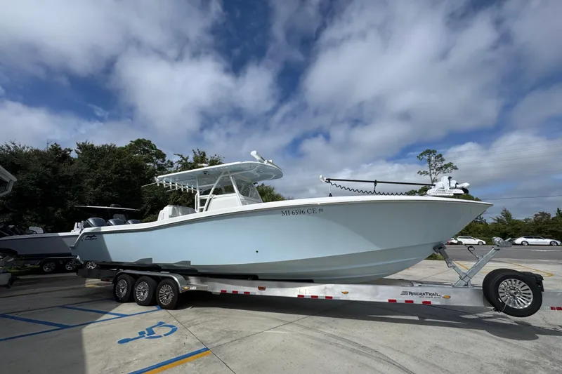  Yacht Photos Pics 2019 Invincible 39 Open Fisherman boat on trailer under cloudy sky.
