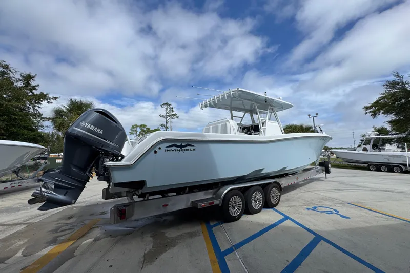  Yacht Photos Pics 2019 Invincible 39 Open Fisherman boat on trailer with Yamaha outboard motor.