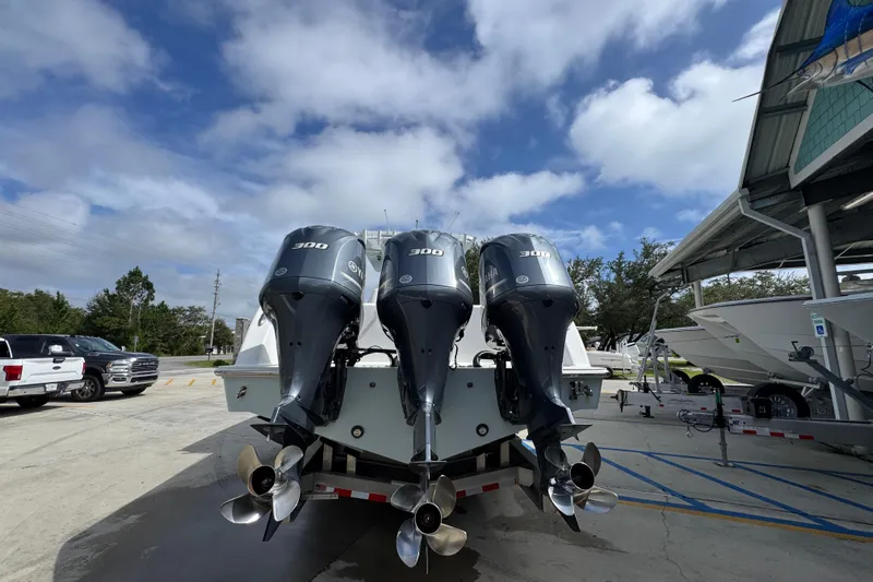  Yacht Photos Pics 2019 Invincible 39 Open Fisherman with triple 300 horsepower engines, parked outdoors.