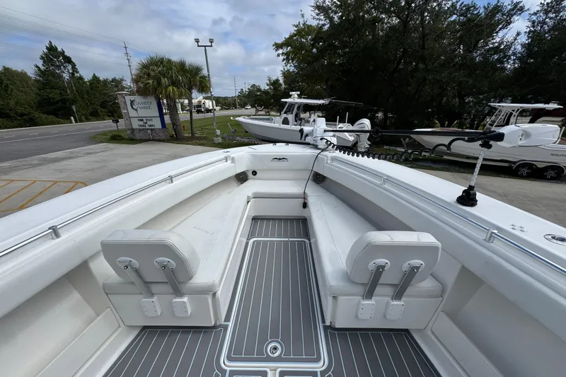 Yacht Photos Pics 2019 Invincible 39 Open Fisherman boat with spacious deck and seating, parked outdoors.