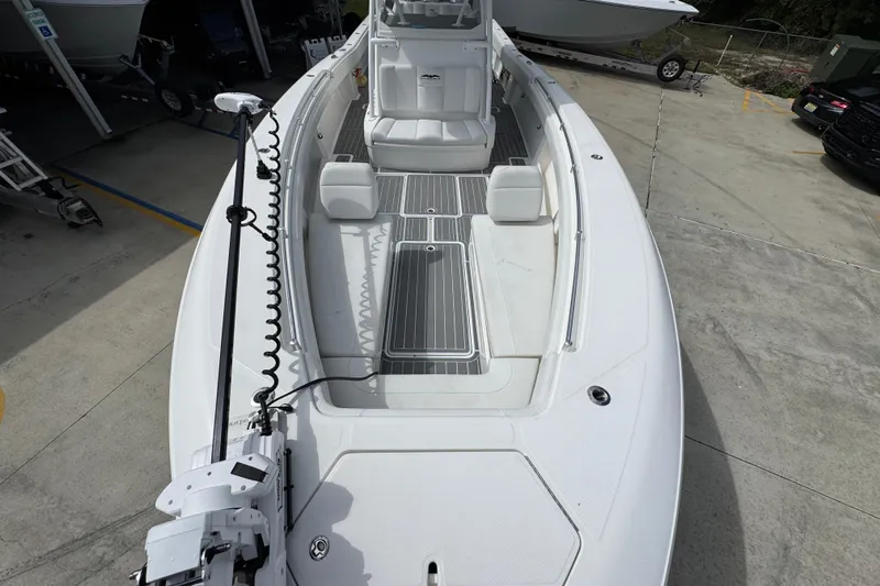  Yacht Photos Pics 2019 Invincible 39 Open Fisherman boat, spacious deck, white seating, docked outdoors.