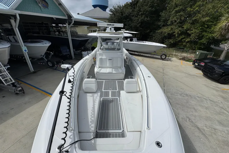  Yacht Photos Pics 2019 Invincible 39 Open Fisherman boat docked at marina, showcasing spacious deck.