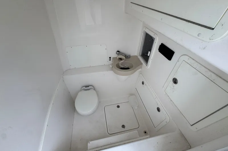  Yacht Photos Pics 2019 Invincible 39 Open Fisherman boat bathroom with toilet and sink.