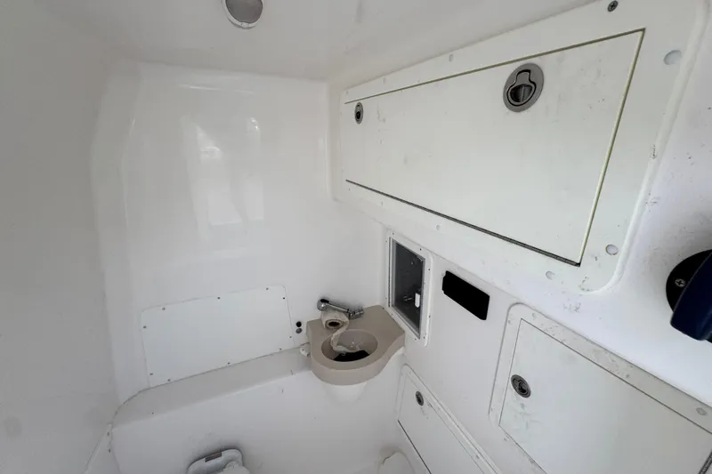  Yacht Photos Pics 2019 Invincible 39 Open Fisherman interior with storage compartments and sink.
